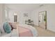 Spacious bedroom with a full-length mirror and en suite bathroom at 370 Sunset Point Dr, Ormond Beach, FL 32174