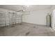 Attached garage with concrete floor and water heater at 370 Sunset Point Dr, Ormond Beach, FL 32174