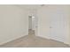 Bedroom with carpeted floor and door to another room at 370 Sunset Point Dr, Ormond Beach, FL 32174