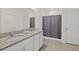 Bathroom with double vanity, granite countertops, and shower at 370 Sunset Point Dr, Ormond Beach, FL 32174