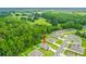 Aerial view of a house in a residential neighborhood with lush green surroundings at 370 Sunset Point Dr, Ormond Beach, FL 32174