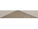 Close-up view of neutral colored wall-to-wall carpeting at 370 Sunset Point Dr, Ormond Beach, FL 32174