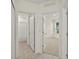 Hallway with doors leading to bedrooms and a bathroom at 370 Sunset Point Dr, Ormond Beach, FL 32174