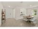 Dining room features a wooden table and open floor plan at 370 Sunset Point Dr, Ormond Beach, FL 32174