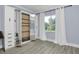 Bedroom with built-in Murphy bed, mirrored closet, and hardwood floors at 1140 S Orlando Ave # F-16, Maitland, FL 32751
