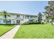 White building with stairs, balconies, and a grassy yard at 1140 S Orlando Ave # F-16, Maitland, FL 32751