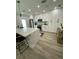 Modern kitchen with white cabinets, marble countertops, and stainless steel appliances at 1140 S Orlando Ave # F-16, Maitland, FL 32751