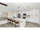 Open concept kitchen with white cabinets and a large island at 1140 S Orlando Ave # F-16, Maitland, FL 32751