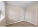 Well-lit bedroom featuring wood-look floors and a closet at 522 Powers Ave, Port Orange, FL 32127