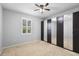 Bedroom with mirrored closet doors and neutral decor at 733 Stone Oak Dr, Sanford, FL 32771