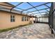 Covered patio with tile flooring and a screened enclosure at 733 Stone Oak Dr, Sanford, FL 32771