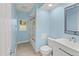 Light blue bathroom with a shower/tub combo and white vanity at 2704 Collingswood Dr, Deltona, FL 32738