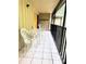 Screened patio with table and four chairs, great for relaxing at 110 Cypress Woods Ct # 7D, Deltona, FL 32725