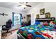 Youth bedroom with a full-size bed and gaming chair at 1438 Gaynor Ct, Deltona, FL 32725