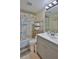 Coastal-themed bathroom with shower/tub and updated vanity at 2625 S Atlantic Ave # 24Nw, Daytona Beach, FL 32118