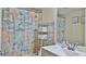 Coastal-themed bathroom with shower/tub and updated vanity at 2625 S Atlantic Ave # 24Nw, Daytona Beach, FL 32118