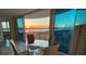 Dining area with glass table and chairs, offering sunset views at 2625 S Atlantic Ave # 24Nw, Daytona Beach, FL 32118
