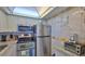 Modern kitchen with stainless steel appliances and granite countertops at 2625 S Atlantic Ave # 24Nw, Daytona Beach, FL 32118