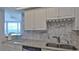 Kitchen boasts granite countertops, white cabinets, and ocean views at 2625 S Atlantic Ave # 24Nw, Daytona Beach, FL 32118