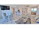 Spacious living room with seating area and glass dining table at 2625 S Atlantic Ave # 24Nw, Daytona Beach, FL 32118