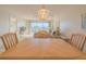 Dining room with table and chairs, offering a view of the living room and water at 4 Oceans West Blvd # 407B, Daytona Beach Shores, FL 32118