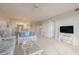 Living room, view of dining area and kitchen at 4 Oceans West Blvd # 407B, Daytona Beach Shores, FL 32118