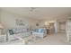 Living room, view of dining area and kitchen at 4 Oceans West Blvd # 407B, Daytona Beach Shores, FL 32118