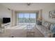 Living room with balcony access and relaxing furniture at 4 Oceans West Blvd # 407B, Daytona Beach Shores, FL 32118