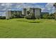 Community view showing building and green space at 4 Oceans West Blvd # 407B, Daytona Beach Shores, FL 32118