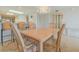 Dining area with wood table and chairs near kitchen at 4 Oceans West Blvd # 407B, Daytona Beach Shores, FL 32118