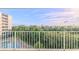 Balcony overlooking a pool, lush landscape, and scenic waterway at 4 Oceans West Blvd # 407B, Daytona Beach Shores, FL 32118