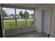 Bright sunroom with view of the neighborhood at 869 Roberts Blvd, Deltona, FL 32725