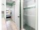 Updated bathroom with a walk-in shower and mosaic tile at 1415 Ocean Shore Blvd # 303, Ormond Beach, FL 32176