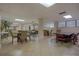 Community room with tables and chairs for gatherings at 1415 Ocean Shore Blvd # 303, Ormond Beach, FL 32176