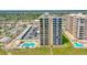Oceanfront condo building with pool and parking area at 1415 Ocean Shore Blvd # 303, Ormond Beach, FL 32176