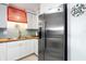 Stainless steel refrigerator in a galley kitchen with wood countertops at 1415 Ocean Shore Blvd # 303, Ormond Beach, FL 32176