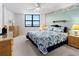 Spacious bedroom with ocean view, king-size bed, and wicker furniture at 1415 Ocean Shore Blvd # 303, Ormond Beach, FL 32176