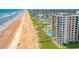 Aerial view of beachfront property and ocean at 1415 Ocean Shore Blvd # 303, Ormond Beach, FL 32176