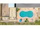 Overhead view of kidney-shaped pool and deck at 1415 Ocean Shore Blvd # 303, Ormond Beach, FL 32176
