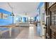 Bright living room with blue walls, tiled floor and wooden table at 1415 Ocean Shore Blvd # 303, Ormond Beach, FL 32176
