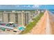 Aerial view of oceanfront condo building and beach at 1415 Ocean Shore Blvd # 303, Ormond Beach, FL 32176