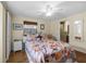 Bright bedroom with a floral comforter and en-suite bathroom access at 6 Da Rosa Ave, Debary, FL 32713