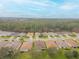 Aerial view of a residential neighborhood with houses and lush greenery at 316 Dahoon Holly Dr, Daytona Beach, FL 32117