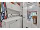 Laundry room features washer, dryer, and access to the kitchen at 316 Dahoon Holly Dr, Daytona Beach, FL 32117