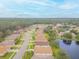 Aerial view of the neighborhood with a pond at 316 Dahoon Holly Dr, Daytona Beach, FL 32117
