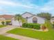 House exterior with a well-manicured lawn at 316 Dahoon Holly Dr, Daytona Beach, FL 32117