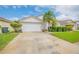 Single-story home with attached garage and landscaped yard at 316 Dahoon Holly Dr, Daytona Beach, FL 32117