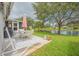 Spacious patio with pond view, seating area, and lush landscaping at 316 Dahoon Holly Dr, Daytona Beach, FL 32117