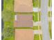An aerial view of a house nestled in a neighborhood near a pond at 316 Dahoon Holly Dr, Daytona Beach, FL 32117
