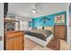 Main bedroom with a king-size bed and teal walls at 316 Dahoon Holly Dr, Daytona Beach, FL 32117